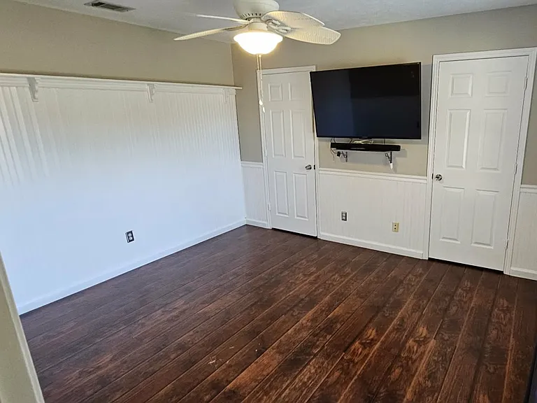 Bedroom 2 has 2 walk in closets. TV can stay if desired