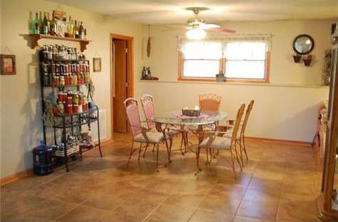 Large dining area with tile flooring.