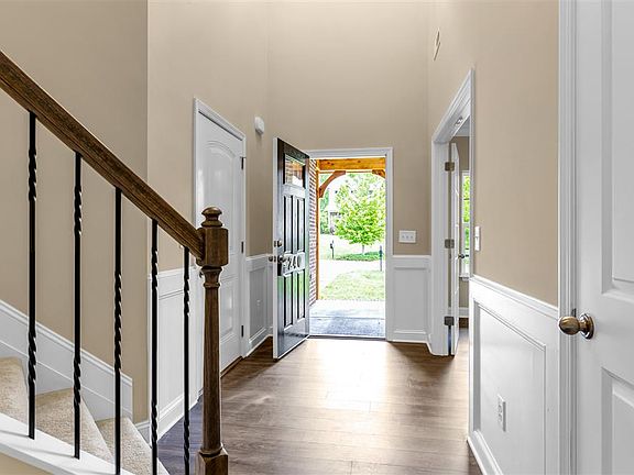 Front door entrance into two story foyer