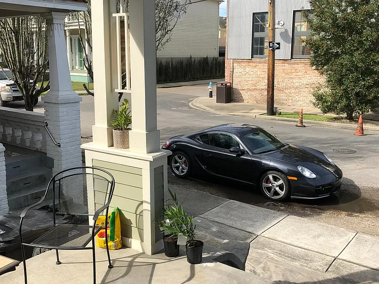 With true New Orleans flair, the home offers a spacious, covered, front porch with plenty of room for a cafe set of outdoor furniture