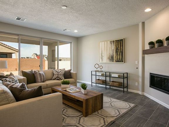 A large sliding glass door takes your indoor gatherings to the backyard and covered patio.