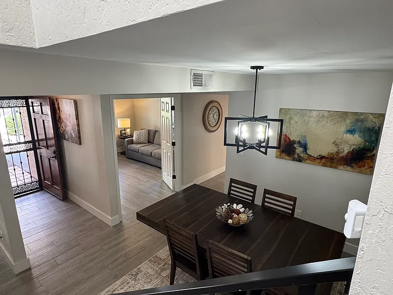 Stair landing - foyer, office entry, and dining area
