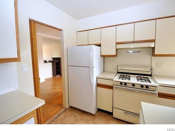 Updated kitchen has plenty of cabinets and counter space.  Appliances include a dishwasher, range and refrigerator.