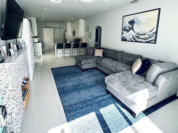 Living room with decorative fireplace