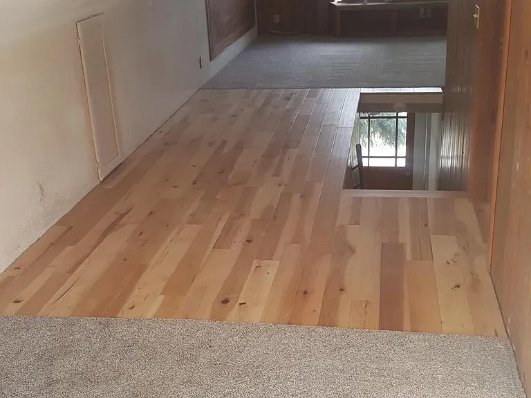 Upstairs has brand new hardwood and carpeting, and full bath
