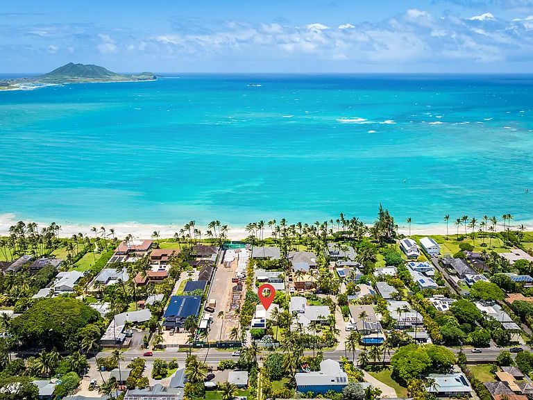 Aerial view of the property's Kailua Beachside location with turquoise ocean views and Marine Corps Base Hawaii in the distance.