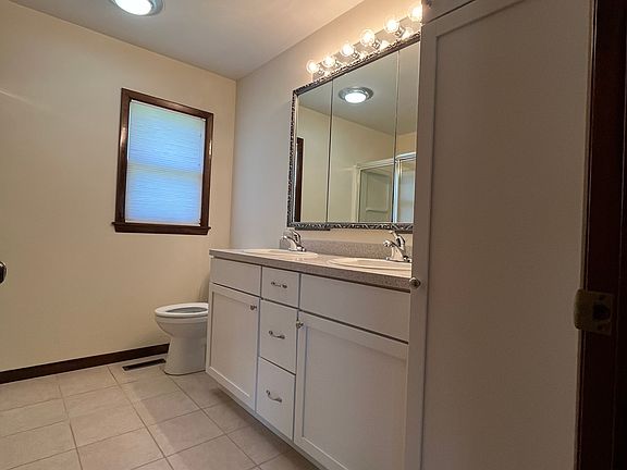 Double vanity with lots of storage in newly remodeled bathroom.