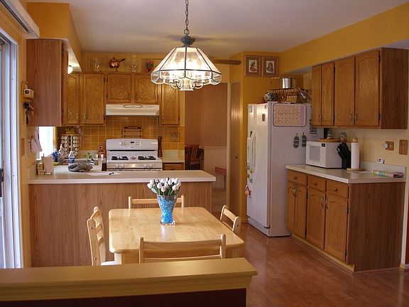Functional Kitchen w/slider to deck and grill area