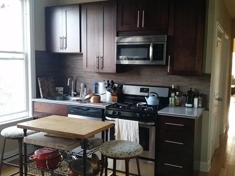Kitchen with lots of light, storage and work area.