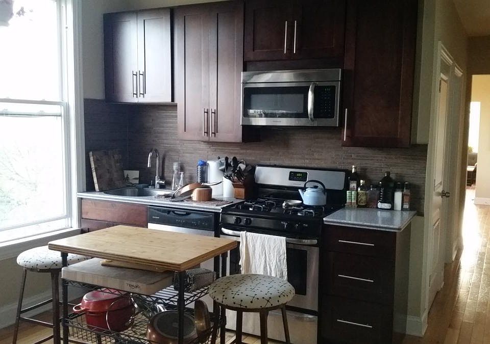 Kitchen with lots of light, storage and work area.