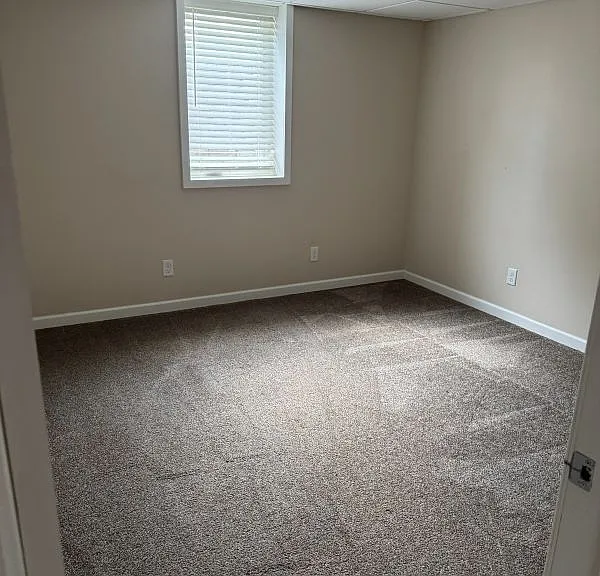Bedroom #4 in basement with legal egress window and window well