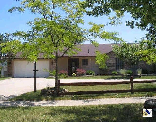 Front of Home with turnaround driveway