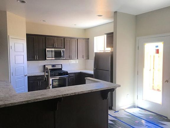 Modern Kitchen with door to back patio
