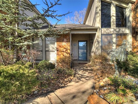 Lush landscaping around the entrance.