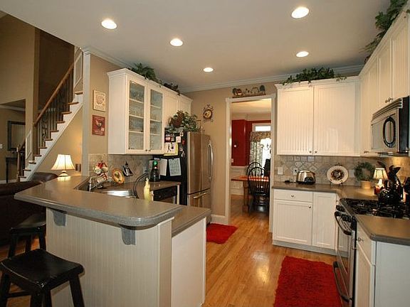Dream kitchen with hard woods, custom cabinets, stone back splash, stainless 