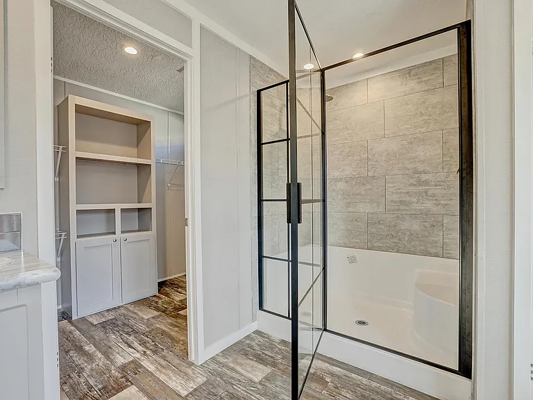 shower in master bath and entry to the walk in closet