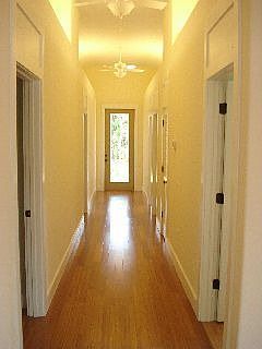 View of Hallway to bedrooms, high cielings open and bright!