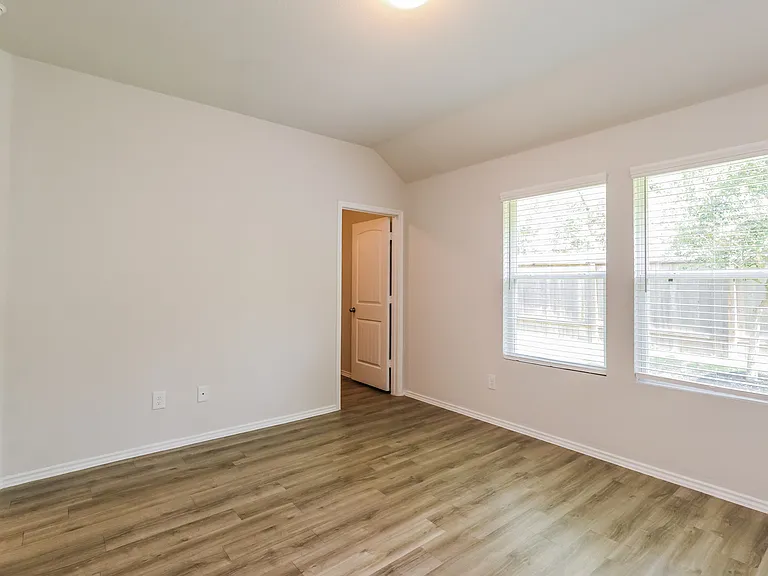 Bright and airy room with large windows, elegant wooden flooring, and freshly painted walls. Bright and airy room with large windows, elegant wooden flooring, and freshly painted walls.