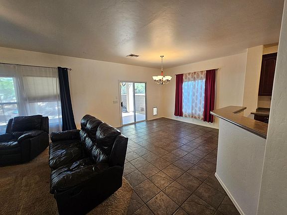 Living room and dining room connected to kitchen.

Pet door in back corner.