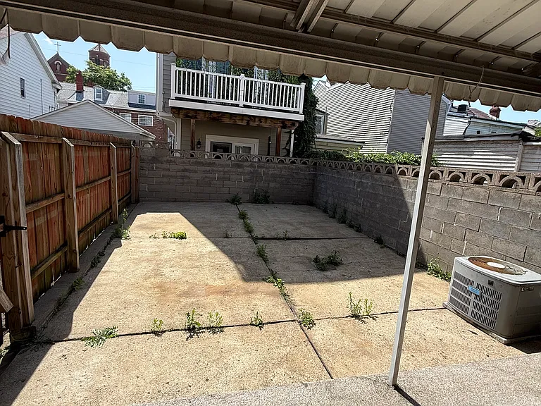 Enclosed back area with covered porch