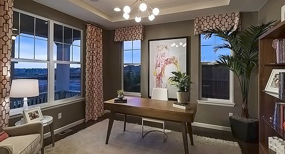The elegant study off the foyer is bright and sunn