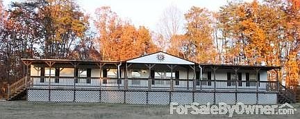 Road Side View
						:
						Front porch extends entire house.
