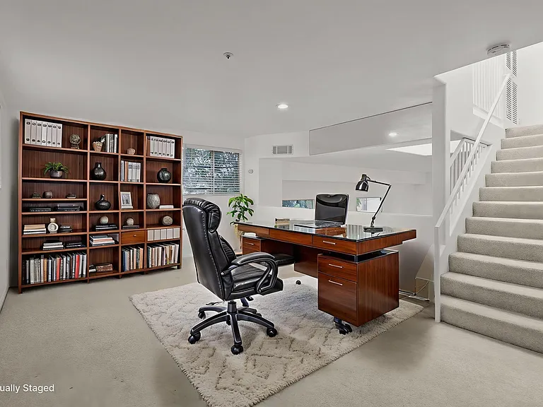 Loft on second floor overlooking the downstairs. Can be used as an office, den, workout room, or extra bedroom.