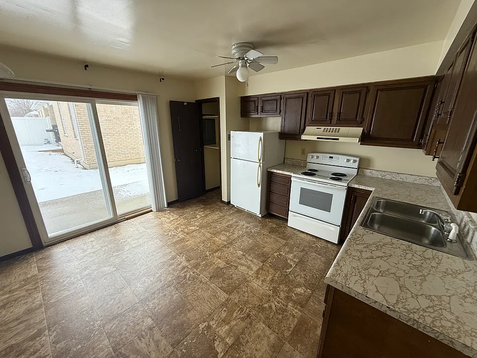 Great kitchen space for ease of meal prep with a patio right outside for grilling