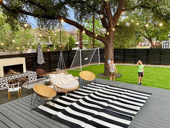 Front yard has astroturf for easier maintenance.