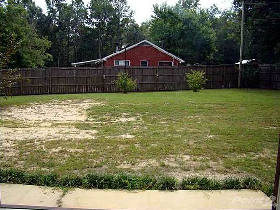 Huge fenced backyard, with double gate.