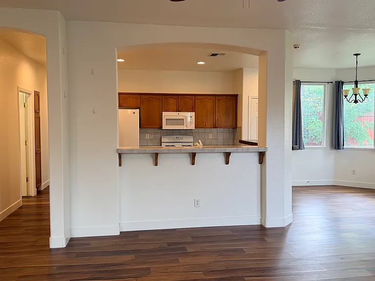 Living Room looking into kitchen and dining room