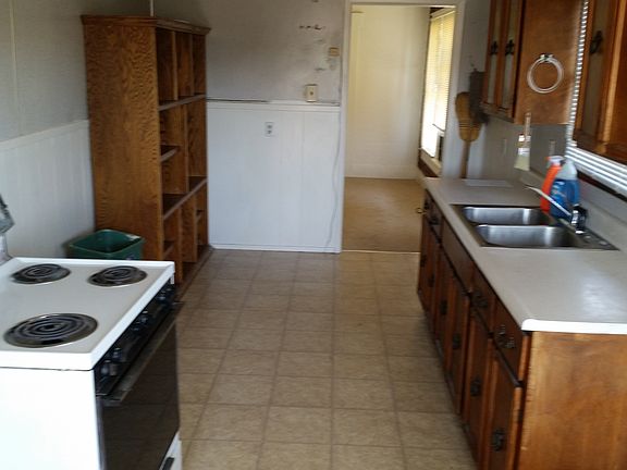 Kitchen with dual stainless steel sink. Window over sink. Hookups for washer and gas or electric dryer.
