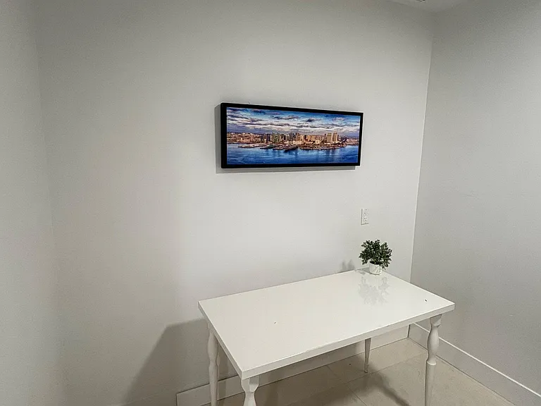 Compact dining nook with a simple table setup, ideal for meals or a small work-from-home station.