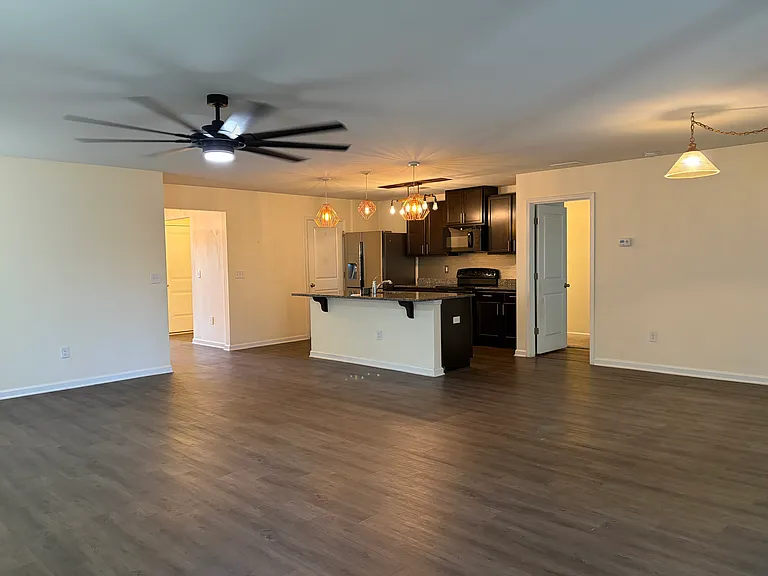 View of kitchen from back corner of family room