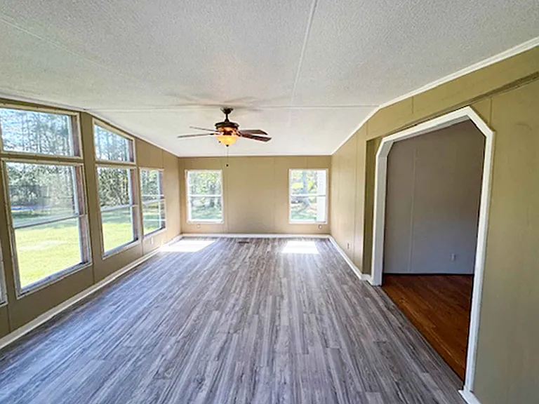 Enjoy backyard views from the sunroom, which opens directly into the dining room for a bright, open living space.