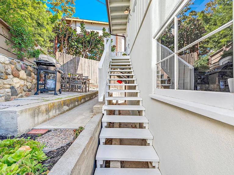 One set of stairs to get to front door, then all one level inside. Gated entrance at bottom of these stairs