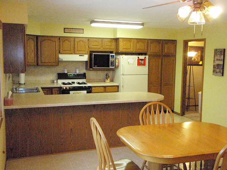 Kitchen and Dinning. Lots of upper and lower cabinet storage, plus a double cabinet door pantry with lazy susan setup. 
Fridge, microwave, gas range/stovetop, and dishwasher.