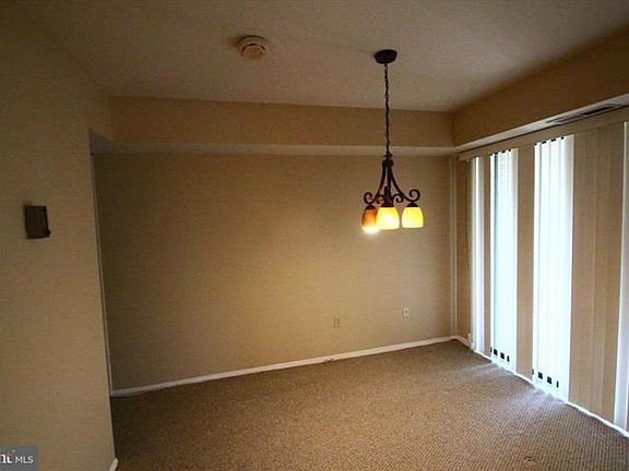 Dining room with sliding glass door that leads to a balcony