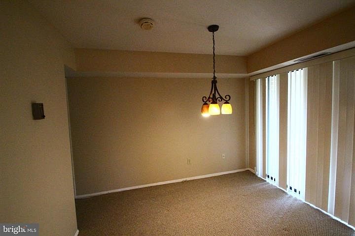 Dining room with sliding glass door that leads to a balcony