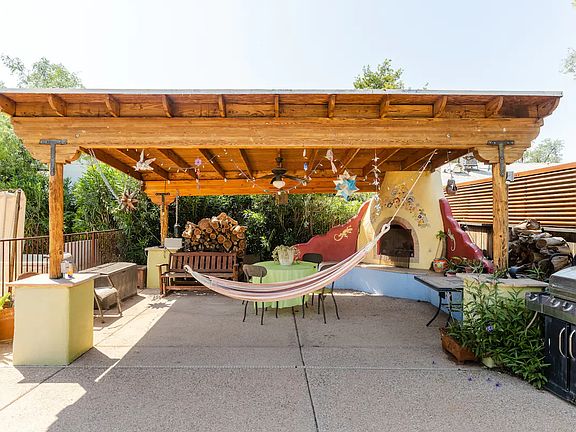 ramada with hammock, table/chairs and wood burning freplace