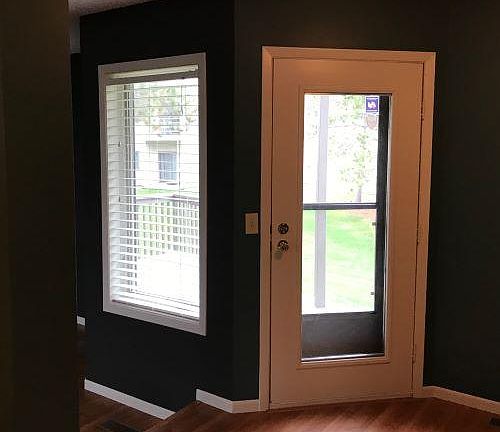 door to deck, near dining area. Step down to living area