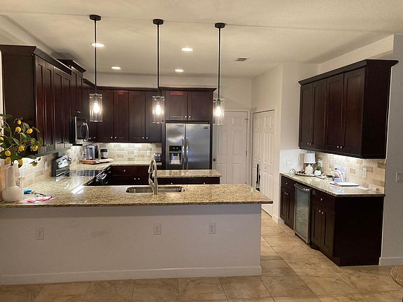 Kitchen, door to access the two car garage. Large pantry