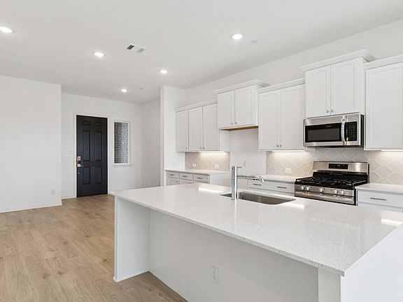 Kitchen in the Hanna Floorplan at Midtown GP in Grand Prairie, TX.