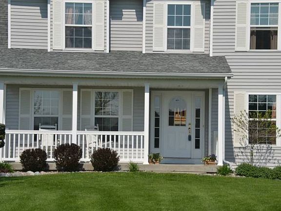 The covered front porch is perfect for enjoying those warm summer evenings.  Plenty of room for furniture in this area.