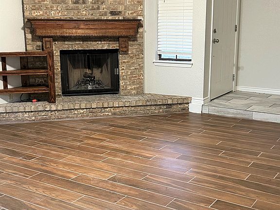 Front entry and fireplace in living room