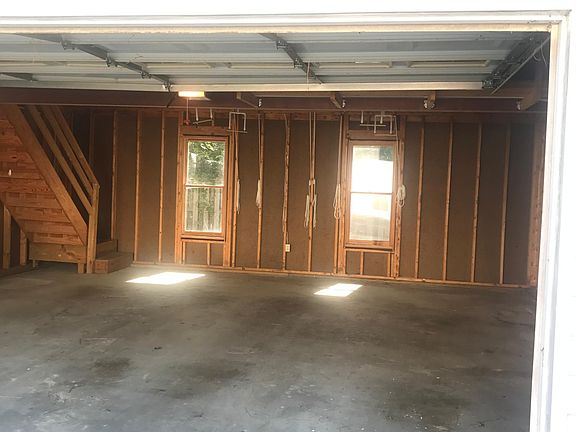 Interior of two car garage with floored attic above.