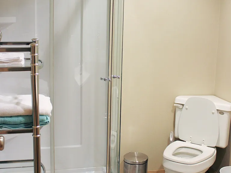 Bathroom with single sink and shower in basement