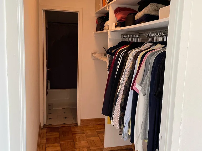 Walk through closet leads to bathroom.