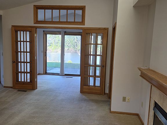 living room facing West to sun-room/patio