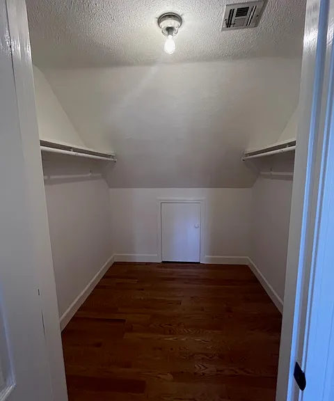 Walk in closet in primary bedroom